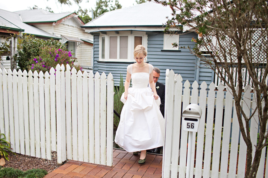 bride walking out of gate