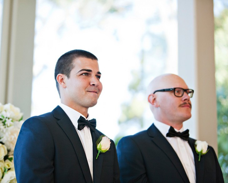 groom waits at alter