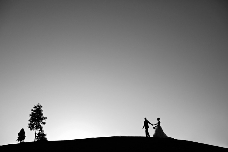 bride groom silhouette on hill